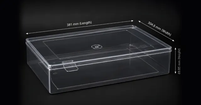 A 12 by 15 by 2.75 inch crystal saree box moulded in clear PET, labelled 381 by 304.8 by 69.85 millimetres.