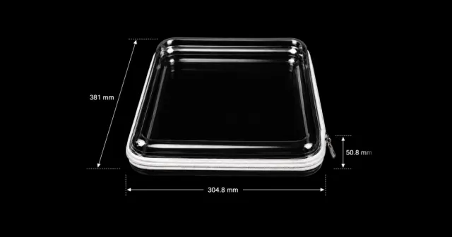 A 12 by 15 inch crystal saree pouch in clear PET, closed by a white fabric zip with a metal pull, labelled 381 by 304.8 by 50.8 millimetres.