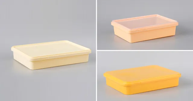 Three tamper-proof sweet containers moulded in cream, peach and yellow: colour is set in the moulding, before any print is added.