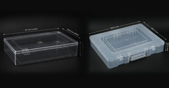 A clear PET crystal saree box beside a translucent PP saree box with a carry handle, both 12 by 15 inches.
